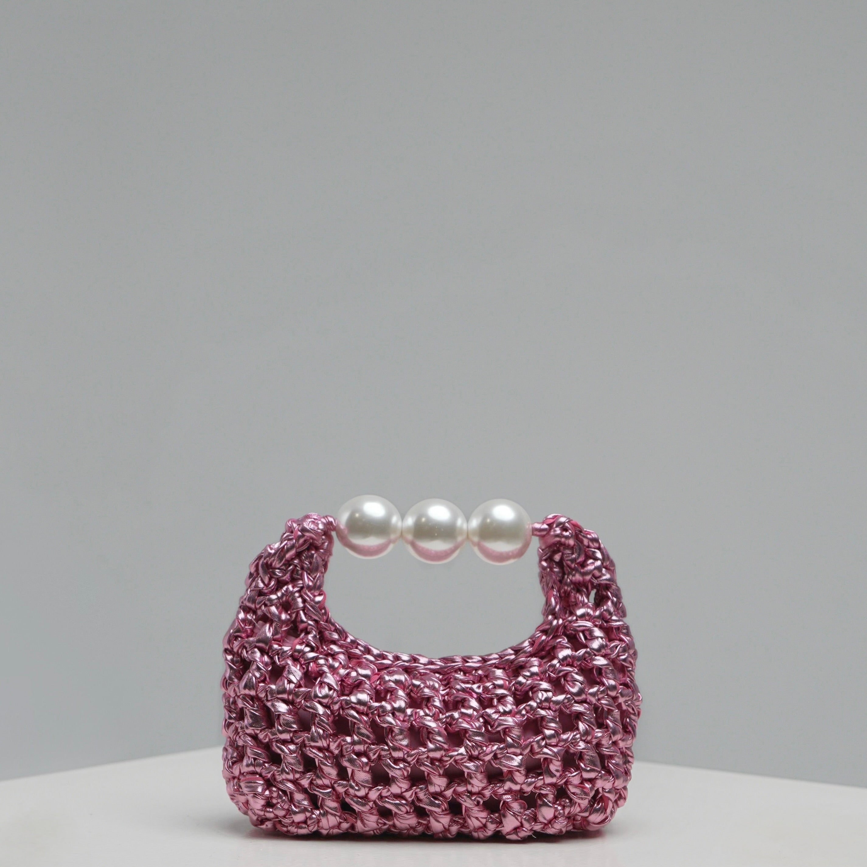 Handmade crochet mini bag Luna by ZOEL, elegant metallic pink luxury bag, Pearl handle