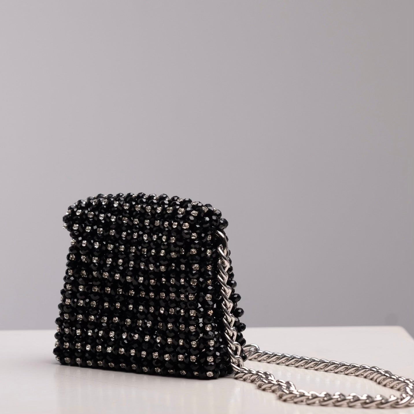 Mini Aurora crossbody bag in black with silver rhinestones and silver chain, handmade by ZOEL