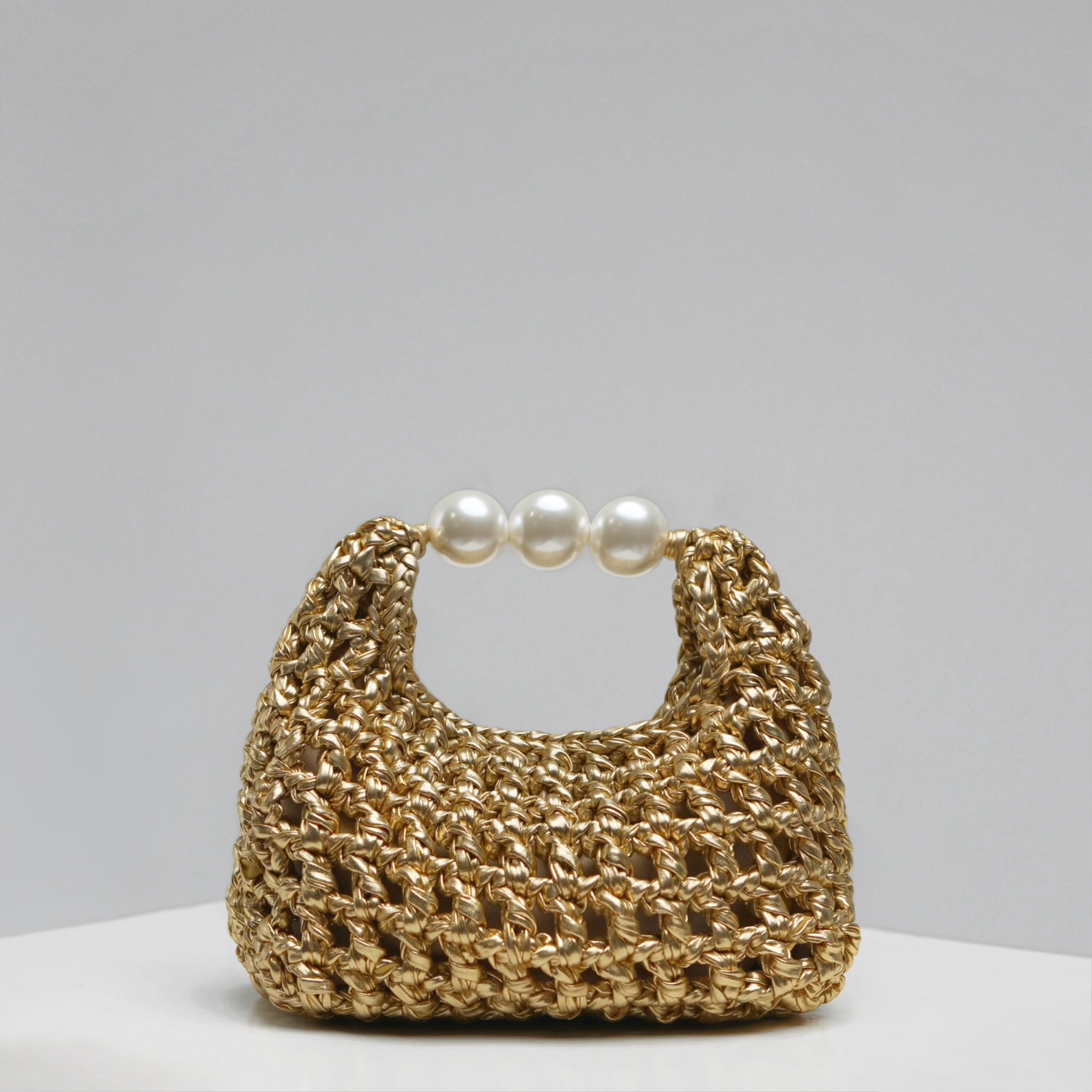 Luna medium handmade bag by ZOEL, gold leather effect with pearl handle, luxury evening bag